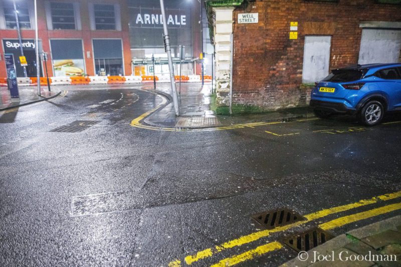 No police are seen detaining anyone and no one is lying collapsed in the road . No revellers at all are seen in Manchester on a New Year night out at the closed clubs around the city centre's Printworks venue